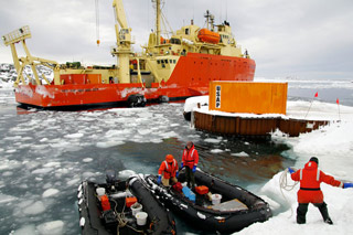 Gould docking at Palmer Station with new fenders attached to the ship