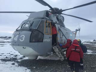 folks boarding the helo