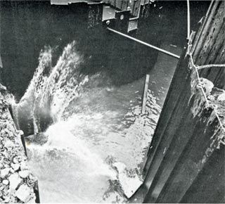 filling the pier sheet pile cells with rocks