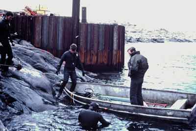 divers working on the pier